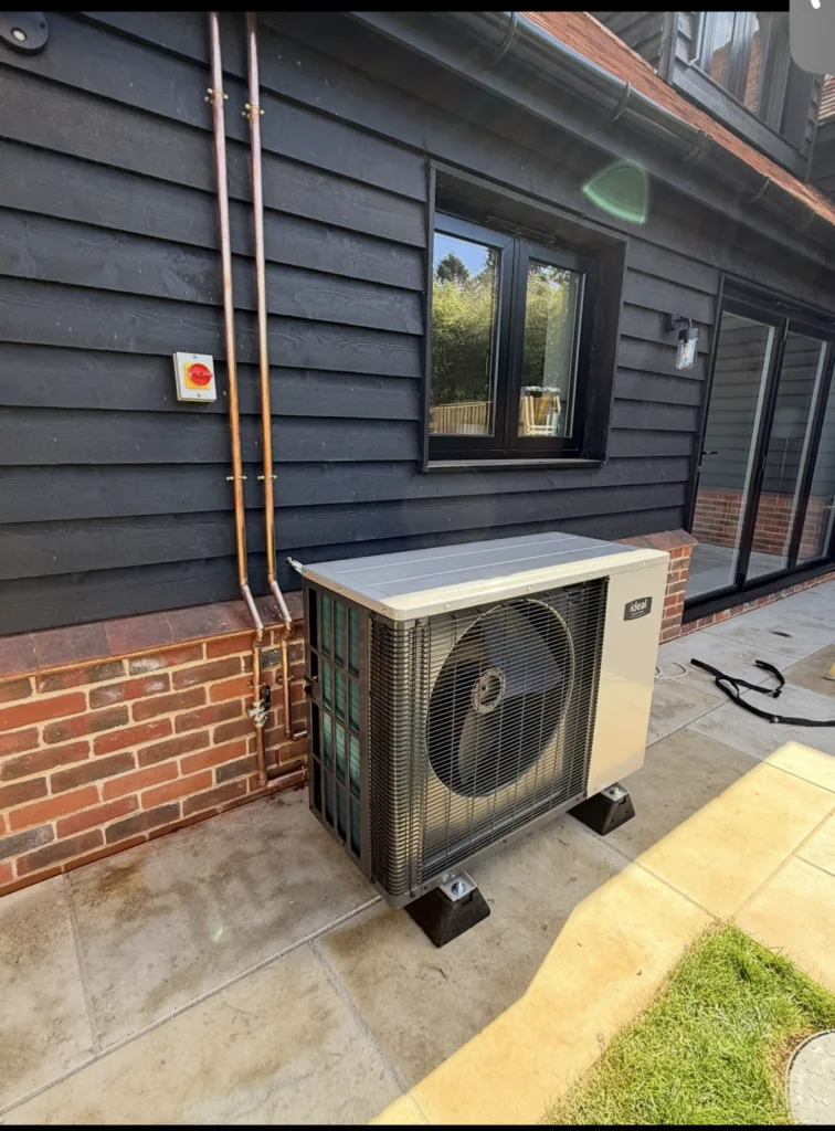 Air source heat pump installed outside a barn conversion