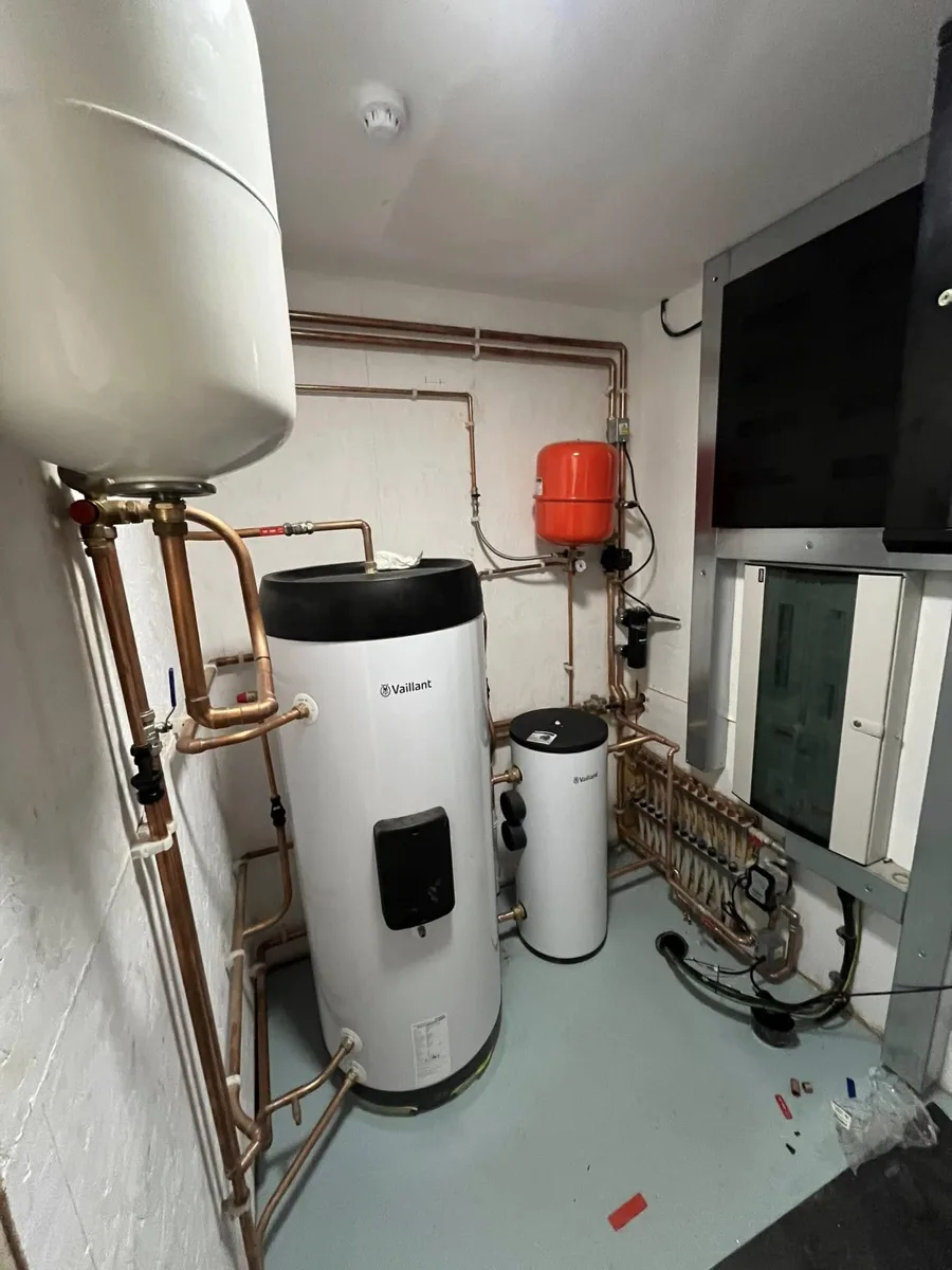 Plant room with unvented hot water cylinder, manifolds and copper pipework